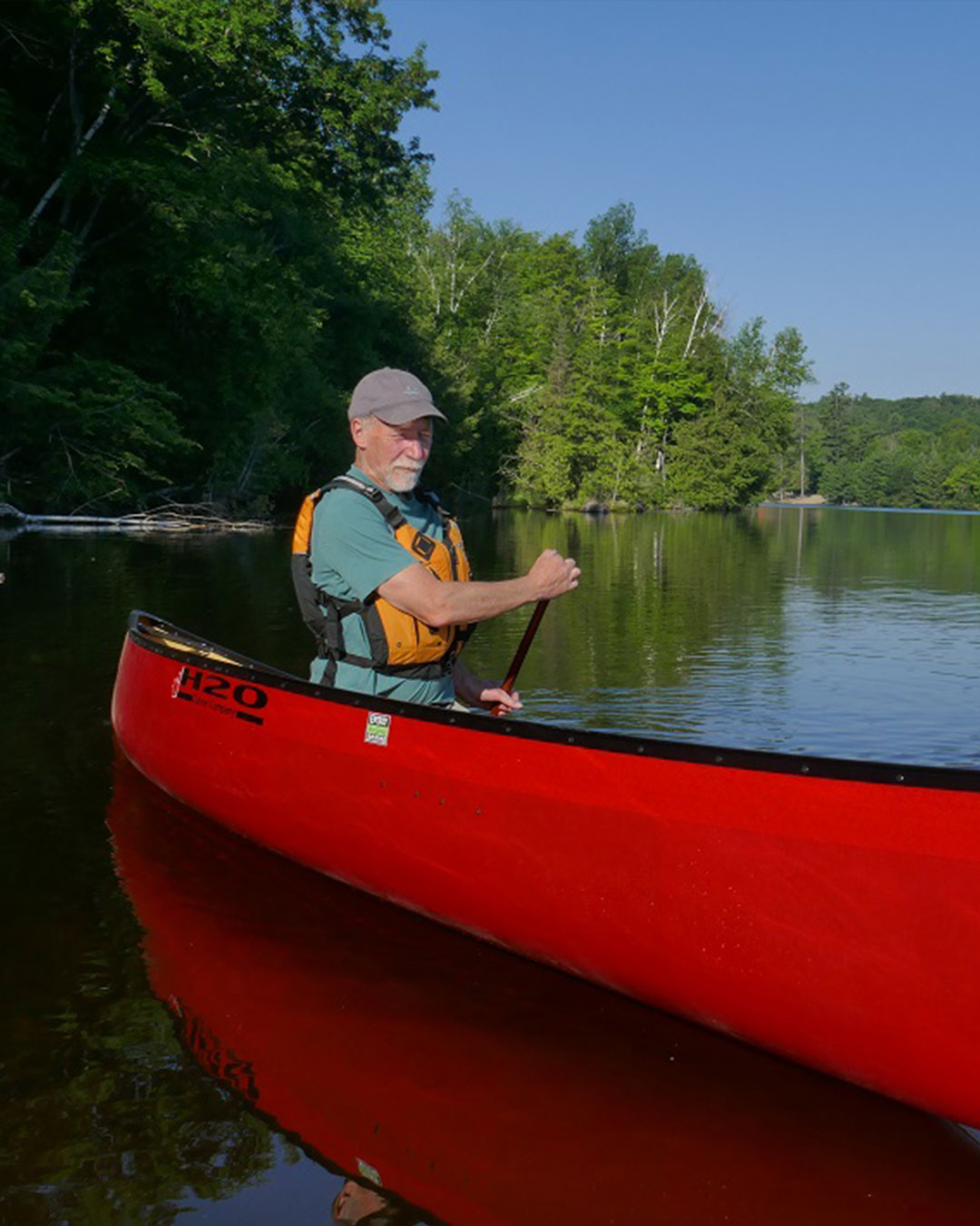 H2O Canoe Company Slideshow - Solo Paddling Red Canoe on Water